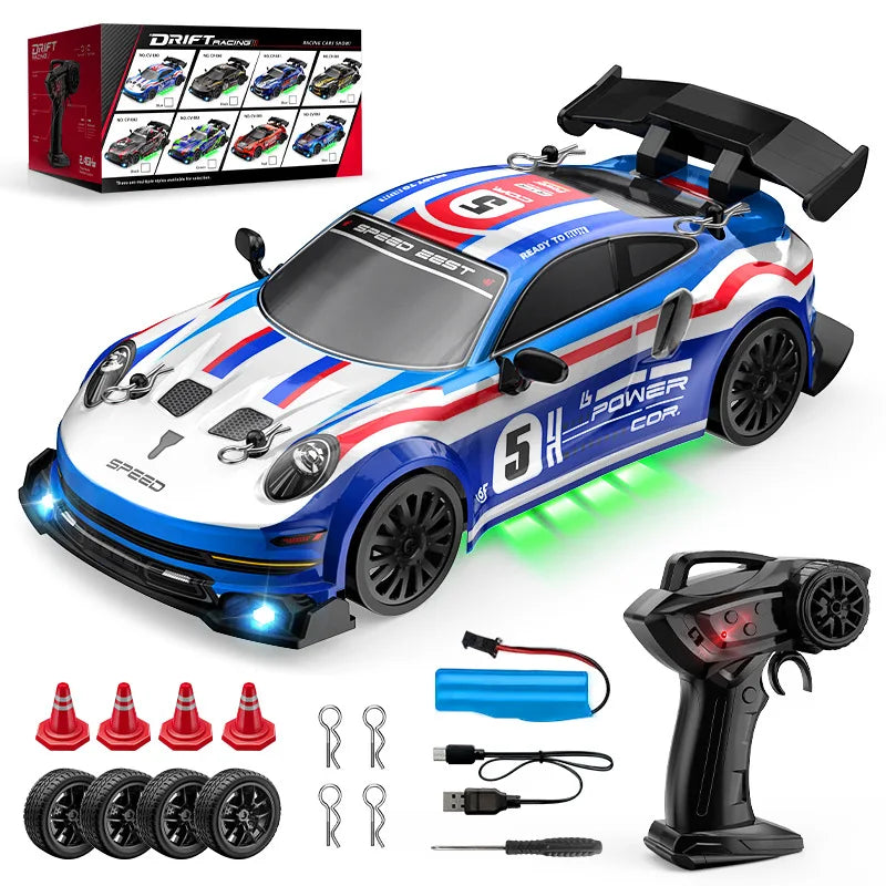 Toy race car with remote control, batteries, and accessories on a white background
