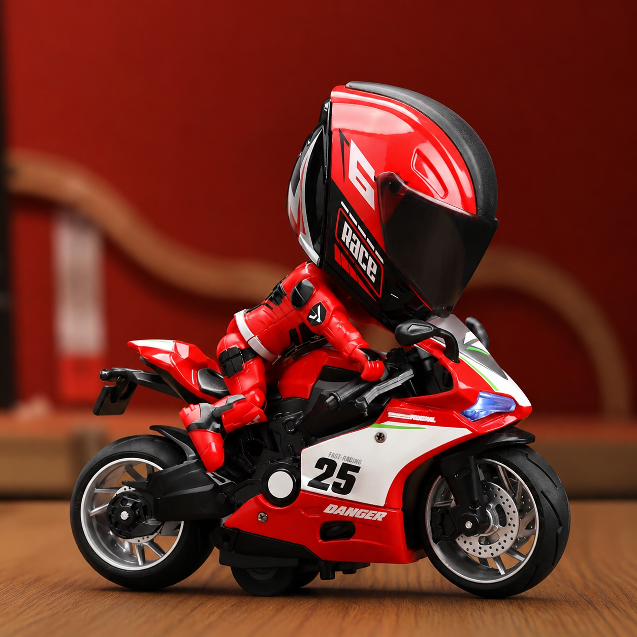 Transformable alloy motorcycle rider toy riding a red racing sports bike with oversized helmet, realistic detailing, and collectible action figure design on a clean background.