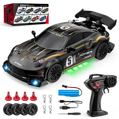 Toy race car with remote control, batteries, and accessories on a white background