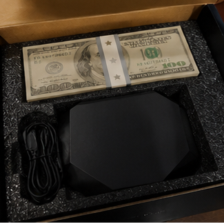Collage of a money-themed product with a screen displaying a vibrant scene, stacks of money, and a glowing orange light.